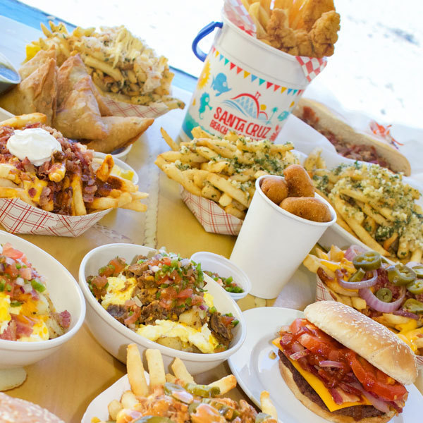 Burgers, fries, chicken and other food on a table
