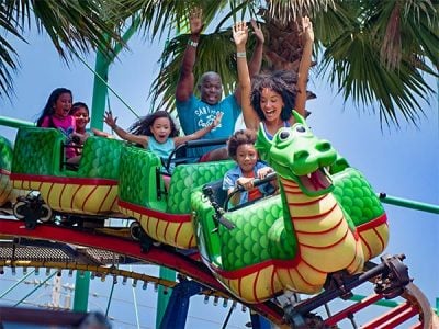 Families enjoying Sea Serpent seaside park ride