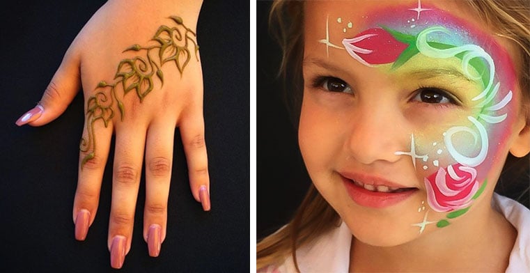 Henna flower design on hand and face paint on child's face