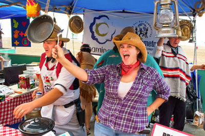 Woman smiling at Chili Cook Off