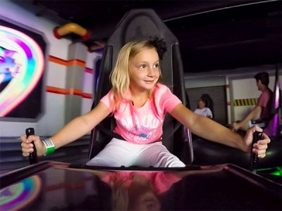 Girl enjoying Space Race ride