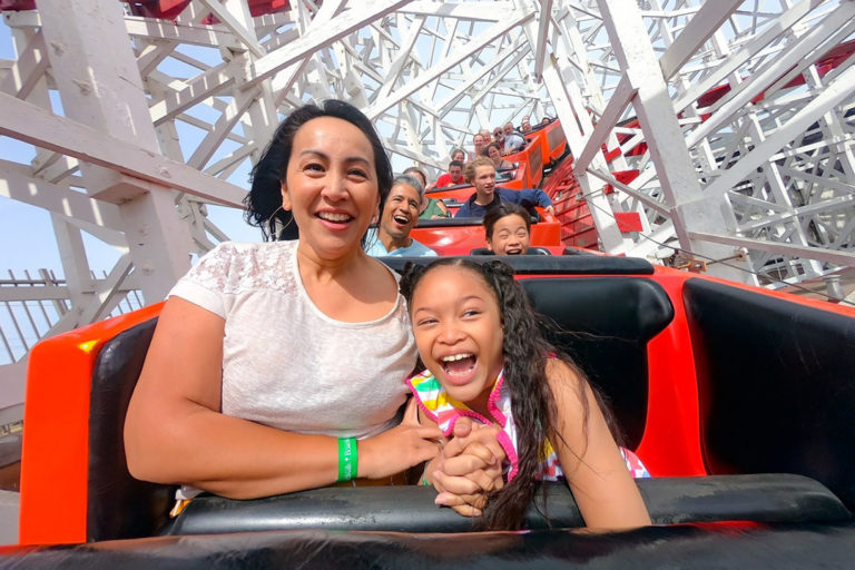 Mom and daughter on Giant Dipper smiling