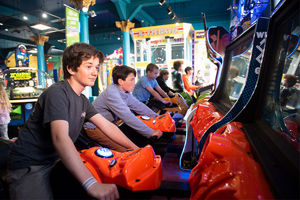 Boys playing on bikes in Arcade