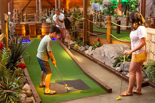 family playing Miniature Golf