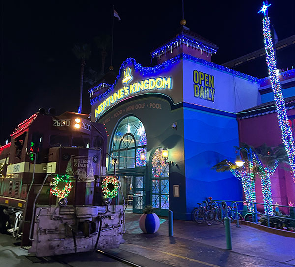 Holiday Lights Train in front of Neptune's Kingdom